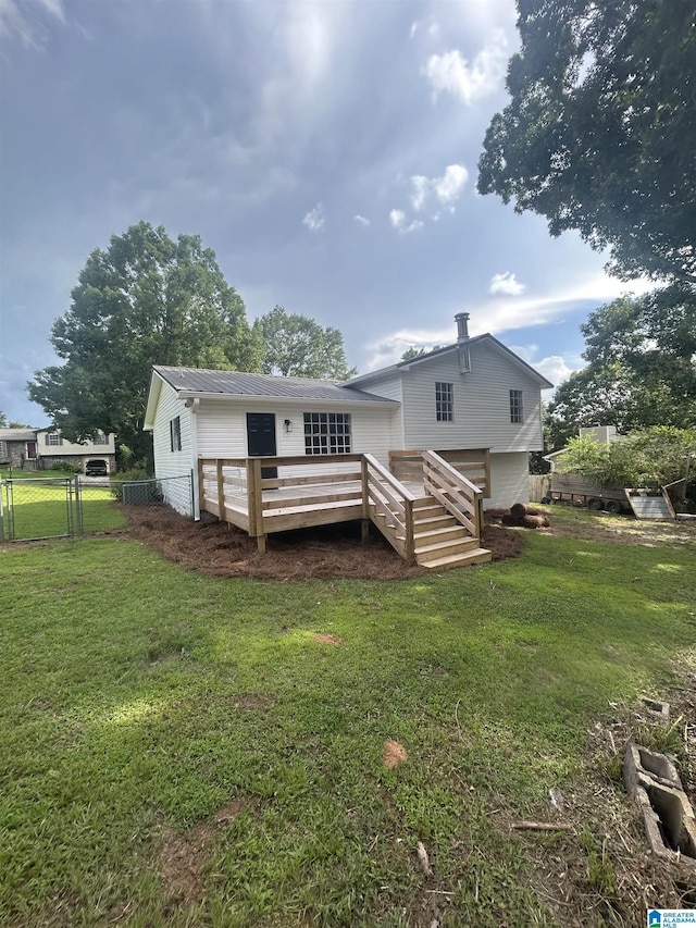 8312 Country Cir, Pinson, AL 35126 - rear view of property featuring a wooden deck, a metal roof, and a gate