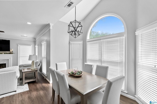 4652 Lake Valley Dr, Hoover, AL 35244 - dining space with dark wood-type flooring, a fireplace, a chandelier, ornamental molding, and recessed lighting