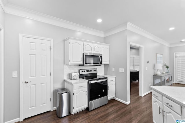 4652 Lake Valley Dr, Hoover, AL 35244 - kitchen with appliances with stainless steel finishes, white cabinets, dark wood-style floors, recessed lighting, and light countertops