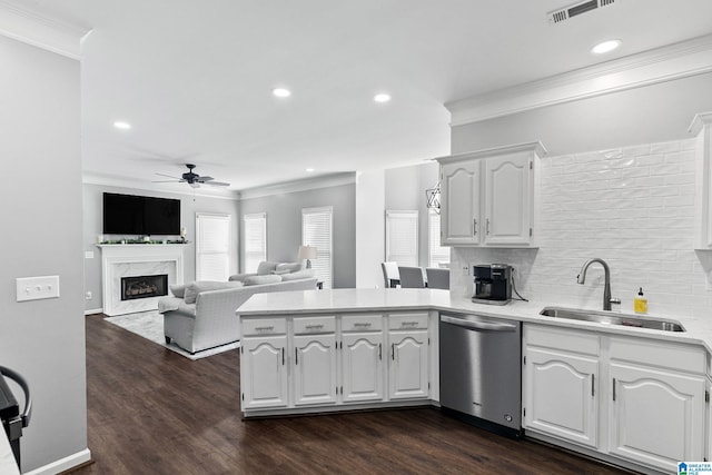 4652 Lake Valley Dr, Hoover, AL 35244 - kitchen with stainless steel dishwasher, crown molding, a peninsula, a ceiling fan, and a fireplace