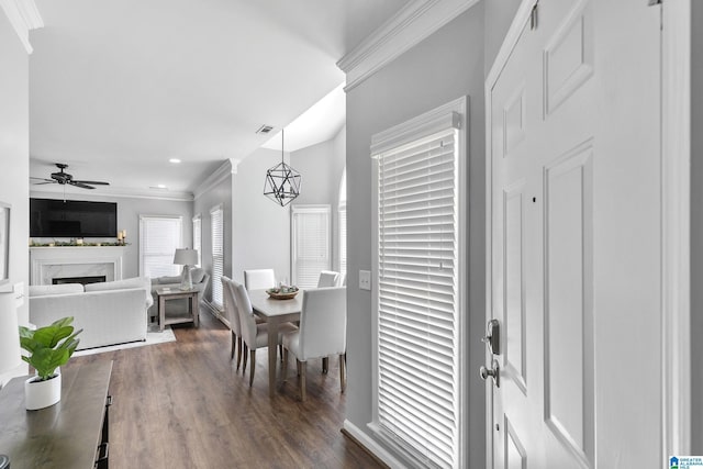 4652 Lake Valley Dr, Hoover, AL 35244 - dining space featuring crown molding, dark wood-style floors, a ceiling fan, a fireplace, and recessed lighting