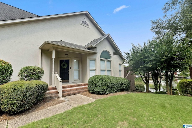 4652 Lake Valley Dr, Hoover, AL 35244 - property entrance with stucco siding, a yard, and roof with shingles