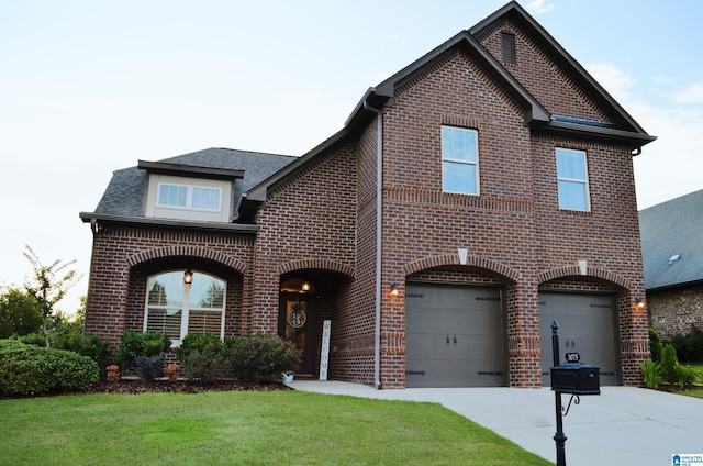 3075 Chelsea Park Rdg, Chelsea, AL 35043 - view of front of home featuring brick siding, a garage, driveway, a front lawn, and roof with shingles