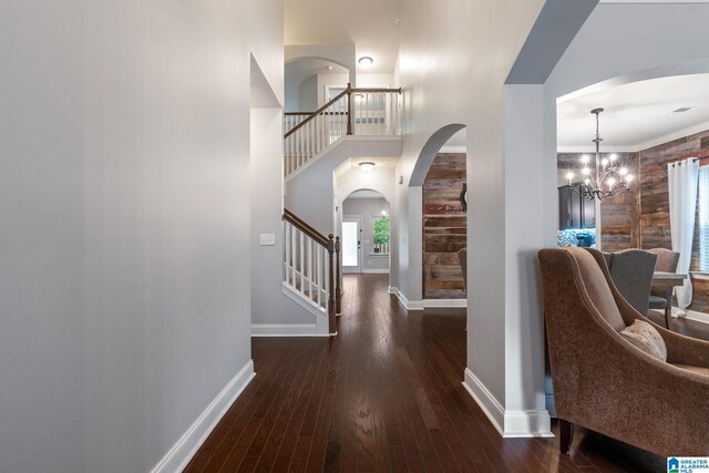 5432 Parkside Cir, Hoover, AL 35244 - foyer entrance with arched walkways, stairs, a chandelier, wood finished floors, and crown molding