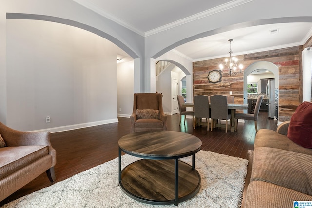 5432 Parkside Cir, Hoover, AL 35244 - living area with arched walkways, dark wood-style floors, a chandelier, and crown molding