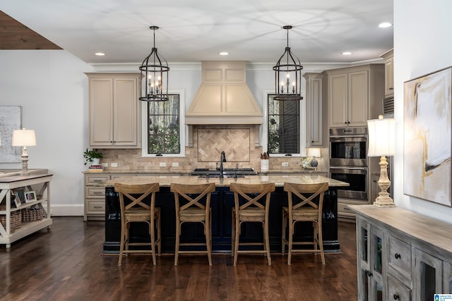 6902 Honor Keith Rd, Trussville, AL 35173 - kitchen with stainless steel double oven, custom range hood, a kitchen island with sink, tasteful backsplash, and recessed lighting