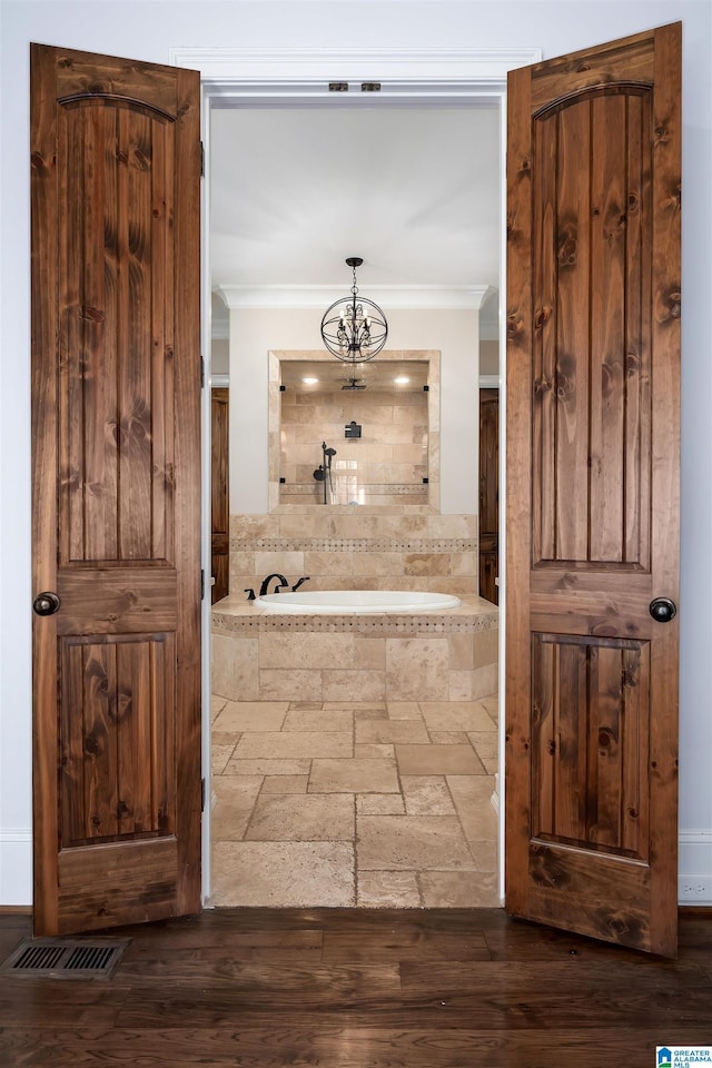 6902 Honor Keith Rd, Trussville, AL 35173 - hallway with ornamental molding and a chandelier
