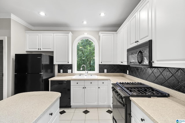 5521 Magnolia Trce, Hoover, AL 35244 - kitchen featuring black appliances, crown molding, light countertops, white cabinets, and light tile patterned floors