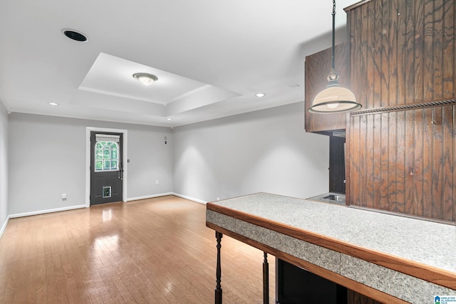 5521 Magnolia Trce, Hoover, AL 35244 - unfurnished bedroom featuring crown molding, a tray ceiling, wood finished floors, and recessed lighting