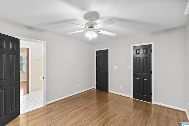 5521 Magnolia Trce, Hoover, AL 35244 - unfurnished bedroom with wood finished floors and a ceiling fan