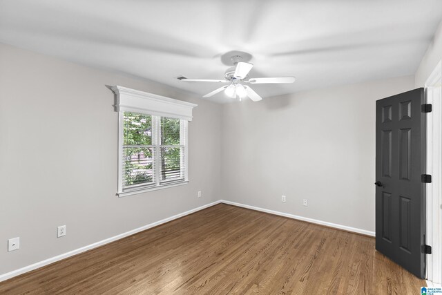 5521 Magnolia Trce, Hoover, AL 35244 - empty room featuring wood finished floors and ceiling fan
