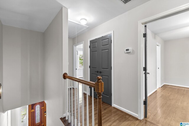 5521 Magnolia Trce, Hoover, AL 35244 - hallway with attic access, wood finished floors, and an upstairs landing