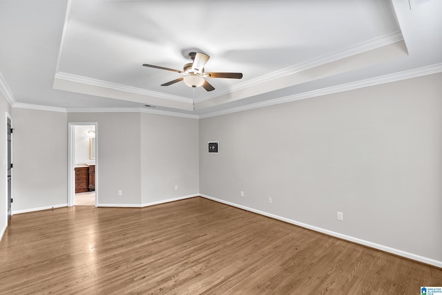 5521 Magnolia Trce, Hoover, AL 35244 - unfurnished room with a tray ceiling, ceiling fan, wood finished floors, and ornamental molding