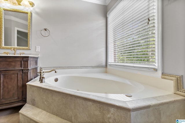 5521 Magnolia Trce, Hoover, AL 35244 - bathroom with vanity, a garden tub, and crown molding