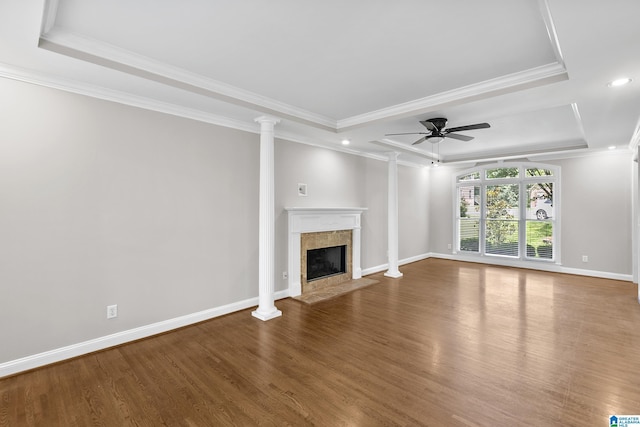 5521 Magnolia Trce, Hoover, AL 35244 - unfurnished living room with ornamental molding, a fireplace, wood finished floors, a ceiling fan, and ornate columns