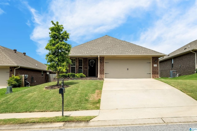 143 Hidden Trace Ct, Montevallo, AL 35115 - view of front of property featuring brick siding, a garage, and a front lawn
