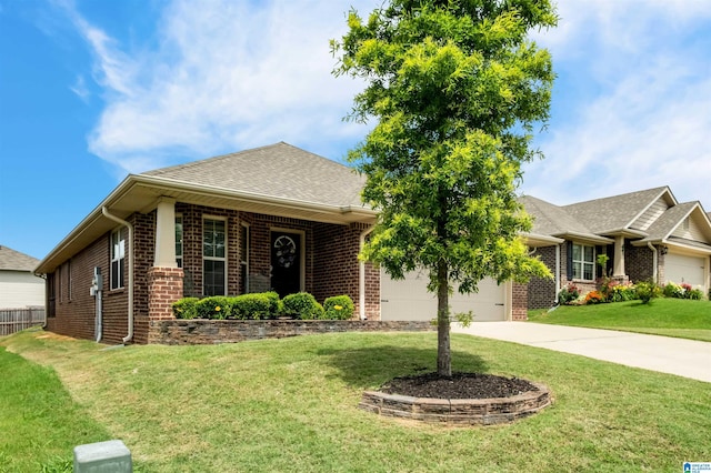 143 Hidden Trace Ct, Montevallo, AL 35115 - view of front facade featuring brick siding, an attached garage, driveway, a front lawn, and roof with shingles