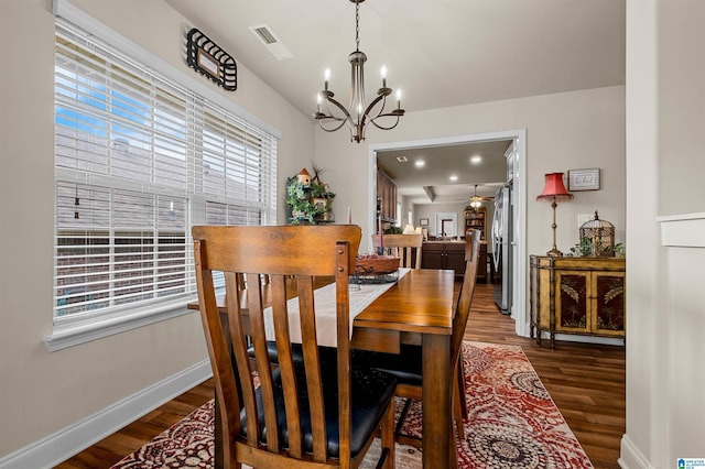 143 Hidden Trace Ct, Montevallo, AL 35115 - dining area with wood finished floors, a chandelier, and ceiling fan
