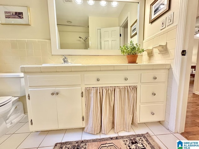 2713 Altadena Lake Rd, Birmingham, AL 35243 - bathroom featuring vanity, tile patterned flooring, and tile walls
