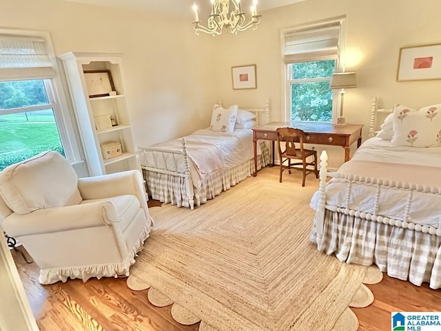 2713 Altadena Lake Rd, Birmingham, AL 35243 - bedroom with a chandelier and wood finished floors