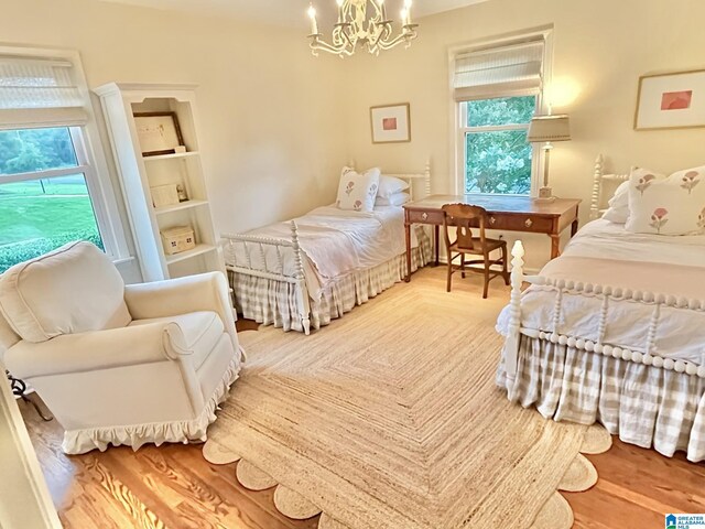 2713 Altadena Lake Rd, Birmingham, AL 35243 - bedroom featuring a chandelier and wood finished floors