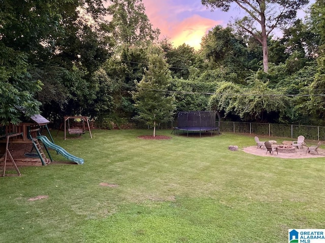 2713 Altadena Lake Rd, Birmingham, AL 35243 - view of yard featuring a fire pit, a trampoline, and a playground