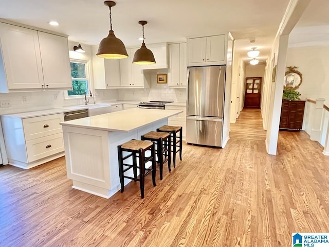 2713 Altadena Lake Rd, Birmingham, AL 35243 - kitchen featuring stainless steel appliances, white cabinets, and a center island