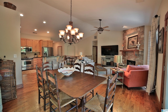 566 County Road 897, Wedowee, AL 36278 - dining room with a ceiling fan, light wood finished floors, recessed lighting, a stone fireplace, and lofted ceiling