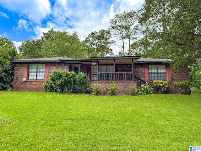 128 Carla Ave, Trussville, AL 35173 - view of front of property featuring brick siding and a front lawn