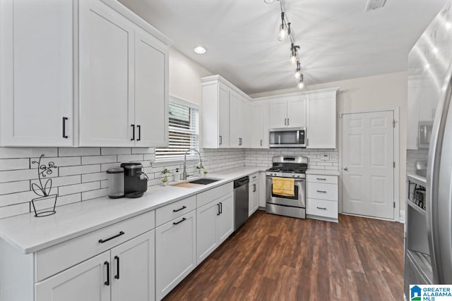 5633 Park Side Rd, Hoover, AL 35244 - kitchen featuring appliances with stainless steel finishes, white cabinetry, light countertops, decorative backsplash, and recessed lighting