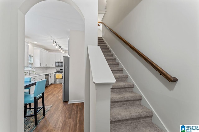 5633 Park Side Rd, Hoover, AL 35244 - stairway with wood finished floors and track lighting
