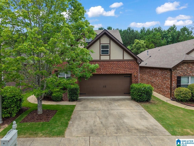 5633 Park Side Rd, Hoover, AL 35244 - view of front of house with brick siding, stucco siding, driveway, and an attached garage