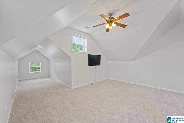 5633 Park Side Rd, Hoover, AL 35244 - additional living space with lofted ceiling, carpet flooring, and healthy amount of natural light
