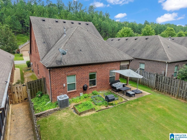 5633 Park Side Rd, Hoover, AL 35244 - rear view of property featuring brick siding, a garden, a patio, a fenced backyard, and an outdoor hangout area