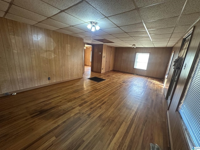 2910 Old Gadsden Hwy, Anniston, AL 36206 - unfurnished room with a paneled ceiling, dark wood-style flooring, and wooden walls