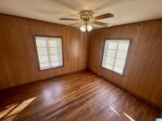 2910 Old Gadsden Hwy, Anniston, AL 36206 - spare room with wood finished floors, ceiling fan, and wooden walls