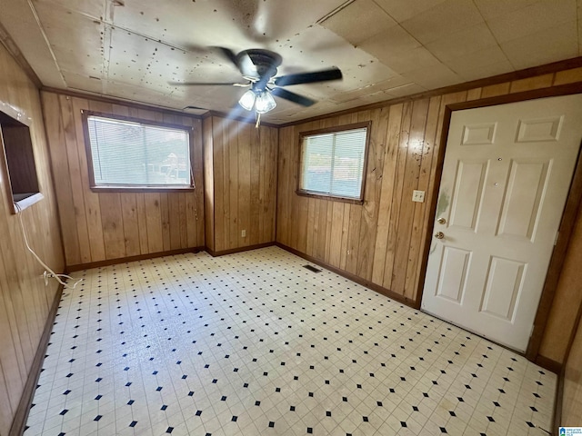 2910 Old Gadsden Hwy, Anniston, AL 36206 - entryway featuring a ceiling fan, wood walls, and light flooring