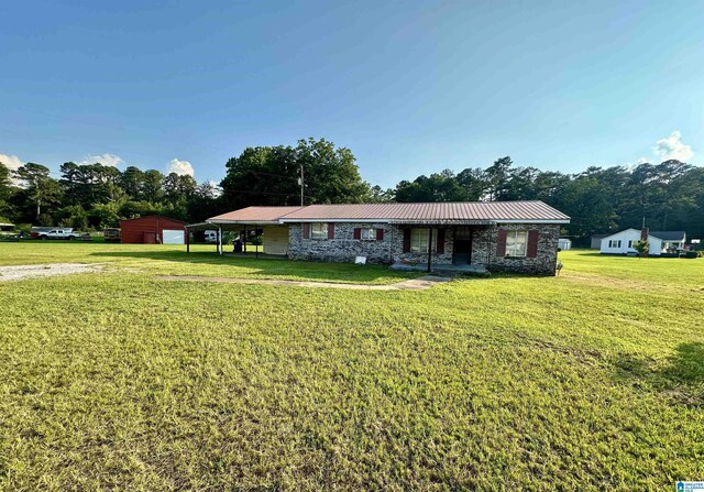 2910 Old Gadsden Hwy, Anniston, AL 36206 - ranch-style home featuring a front yard and a metal roof