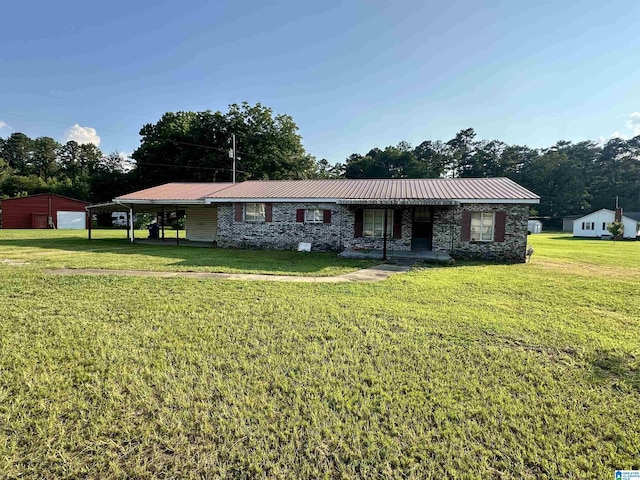 2910 Old Gadsden Hwy, Anniston, AL 36206 - ranch-style home with a front lawn, a garage, and a metal roof