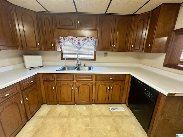 2910 Old Gadsden Hwy, Anniston, AL 36206 - kitchen featuring dishwasher, light countertops, and a drop ceiling