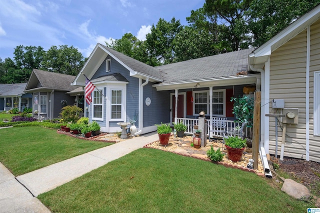 3479 Wildewood Dr, Pelham, AL 35124 - ranch-style house featuring covered porch and a front lawn
