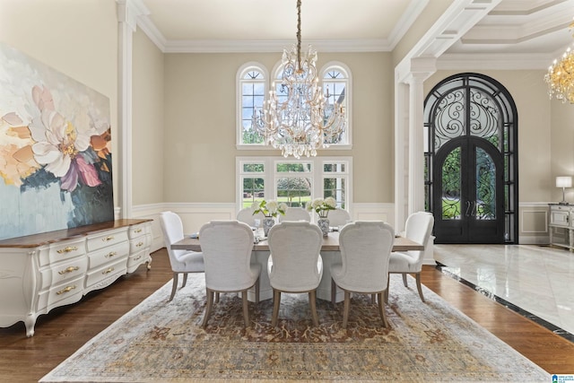 5615 Canongate Ln, Hoover, AL 35242 - dining room featuring a chandelier, french doors, ornamental molding, wainscoting, and decorative columns