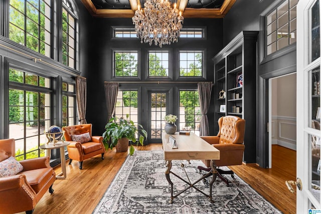 5615 Canongate Ln, Hoover, AL 35242 - office space featuring a towering ceiling, a chandelier, wood finished floors, healthy amount of natural light, and crown molding