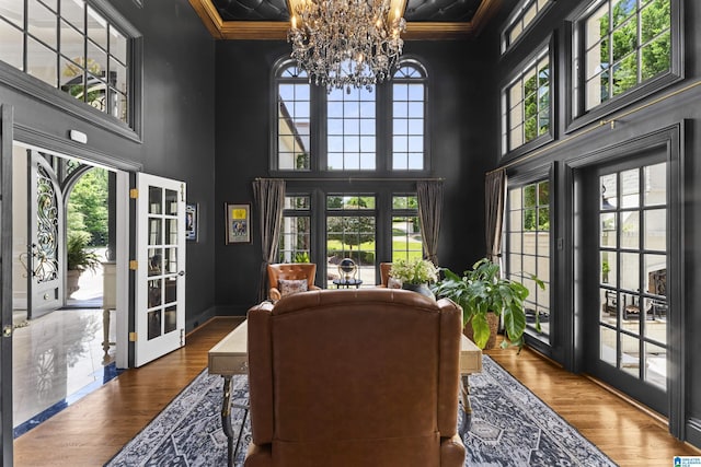 5615 Canongate Ln, Hoover, AL 35242 - office area with a chandelier, a high ceiling, crown molding, wood finished floors, and coffered ceiling