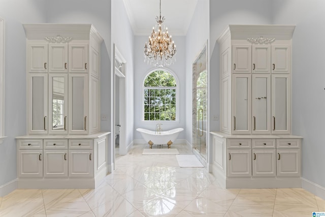 5615 Canongate Ln, Hoover, AL 35242 - bathroom featuring a chandelier, a freestanding bath, marble finish floors, ornamental molding, and a stall shower
