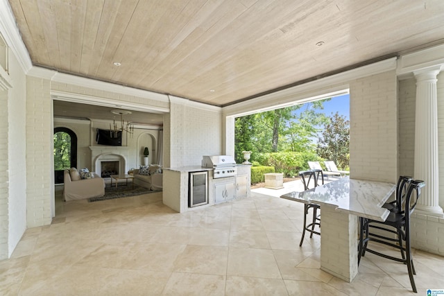 5615 Canongate Ln, Hoover, AL 35242 - view of patio with an outdoor fireplace and exterior kitchen