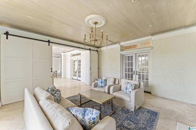 5615 Canongate Ln, Hoover, AL 35242 - living area featuring a barn door, french doors, brick wall, wood ceiling, and ornamental molding