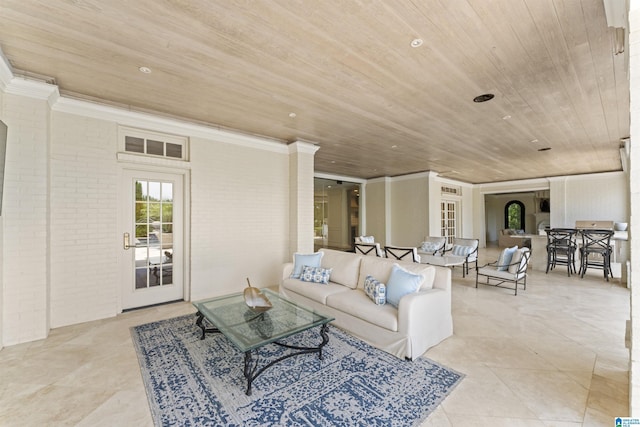 5615 Canongate Ln, Hoover, AL 35242 - living room featuring wooden ceiling, light tile patterned floors, brick wall, and ornamental molding