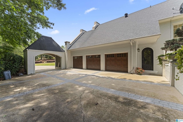 5615 Canongate Ln, Hoover, AL 35242 - view of side of property featuring a shingled roof and driveway