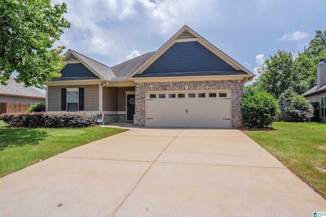 4955 Stonecreek Way, Calera, AL 35040 - craftsman house with an attached garage, concrete driveway, and brick siding